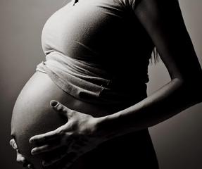 Pregnant Lady getting help with acupuncture